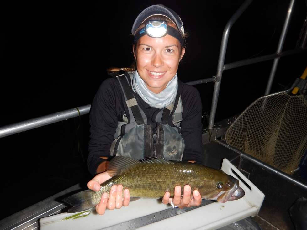 Kaitlyn displays a largemouth bass during night time boat electrofishing surveys.
